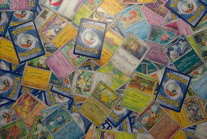 a bunch of pokemon cards on a table.